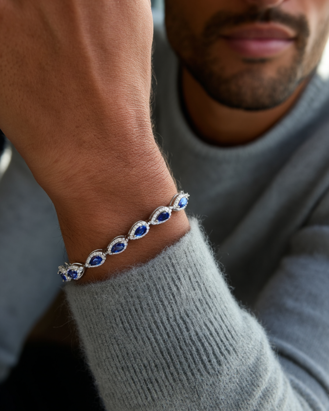 Blue Zirconia Teardrop Bracelet, Silver-Plated — Bracelet styled with grey knitwear
