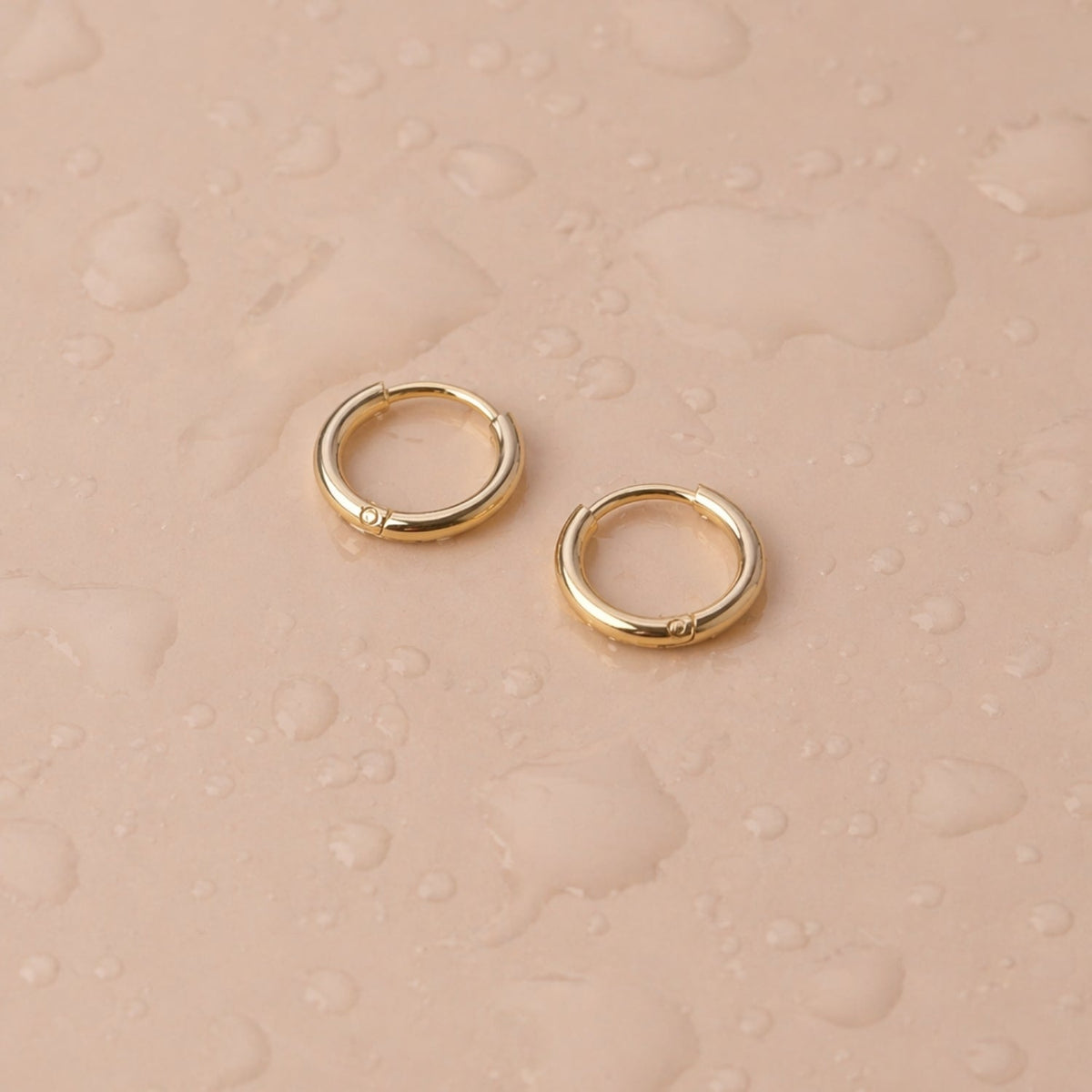 Tiny Huggie Hoops 7